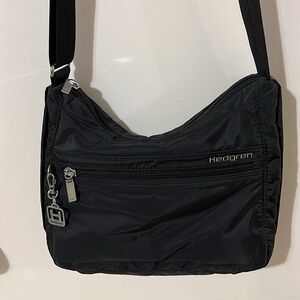VGUC Hedgren black crossbody bag. 11”W x 3”D at bottom. 9” high. Lightweight.